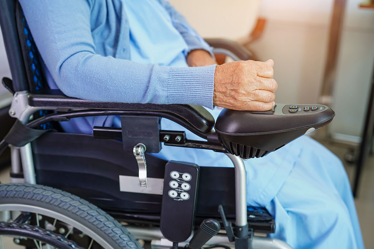 Asian elderly woman disability patient sitting