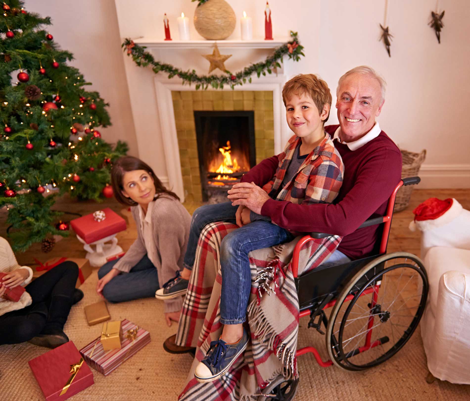 family-opening-christmas-presents-near-a-tree